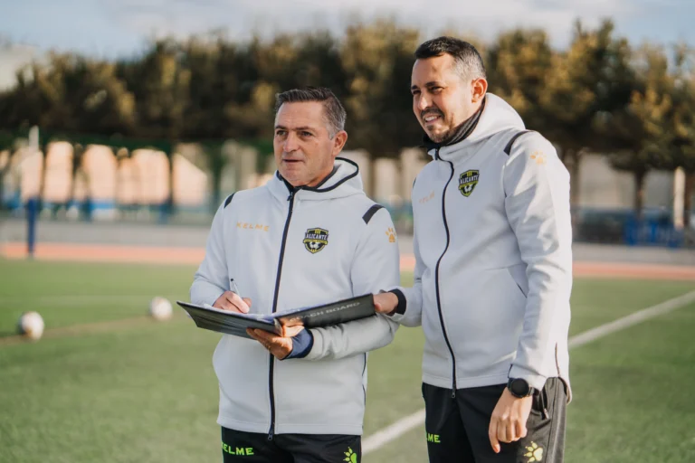 soccer scouted looking at players