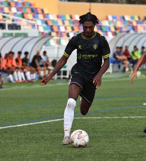 alicante football academy player dribbling soccer ball
