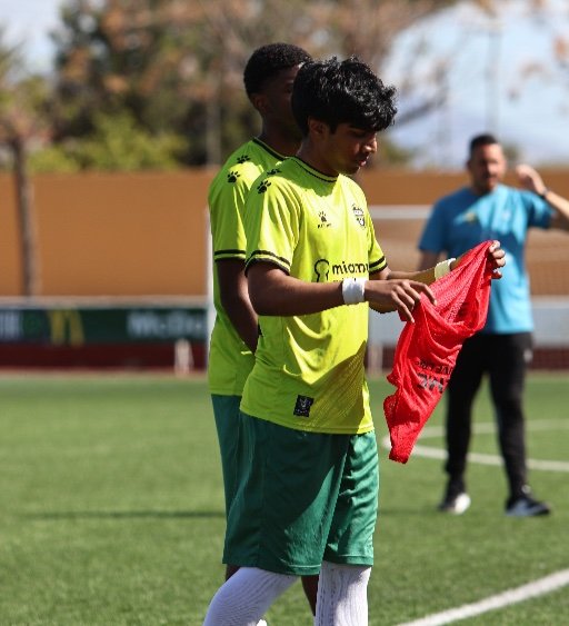 soccer players preparing for warm up drill on the pitch