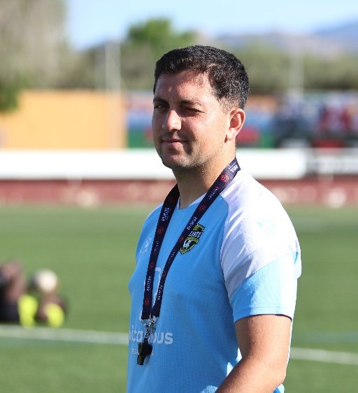 alicante football academy coach on football pitch