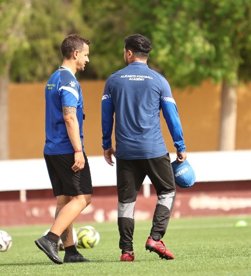alicante football academy coaches discussing soccer career development