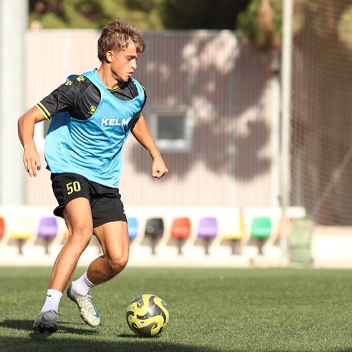 football player dribbling during scouting trial