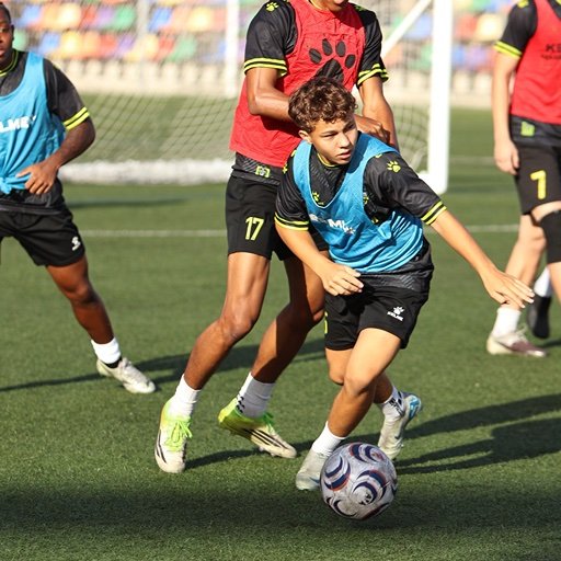 football players competing for ball in best football boots